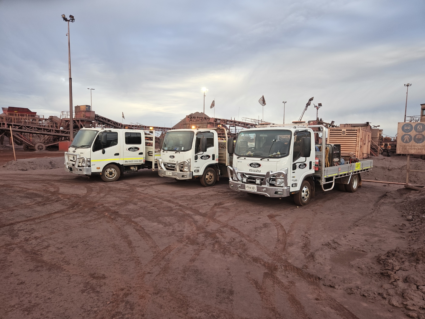 A1 Welding service trucks at an industrial work site